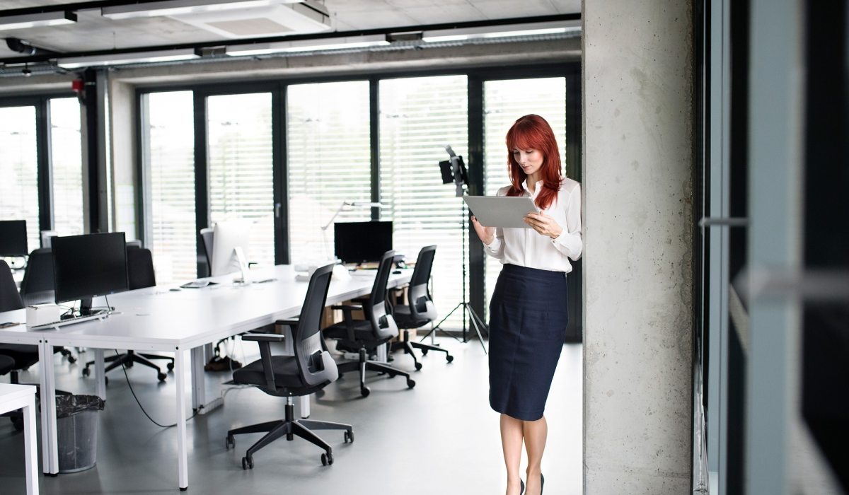 Businesswoman-with-tablet-in-her-office-working.