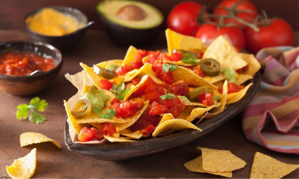 nachos-loaded-with-salsa-guacamole-cheese-and-P7GUFN7
