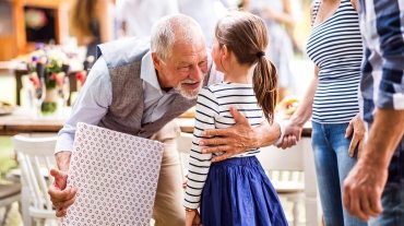 family-celebration-or-a-garden-party-outside-in-PVHU9JN