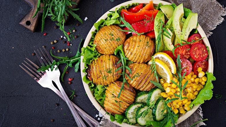vegetarian-buddha-bowl-raw-vegetables-and-baked-KAYZM53