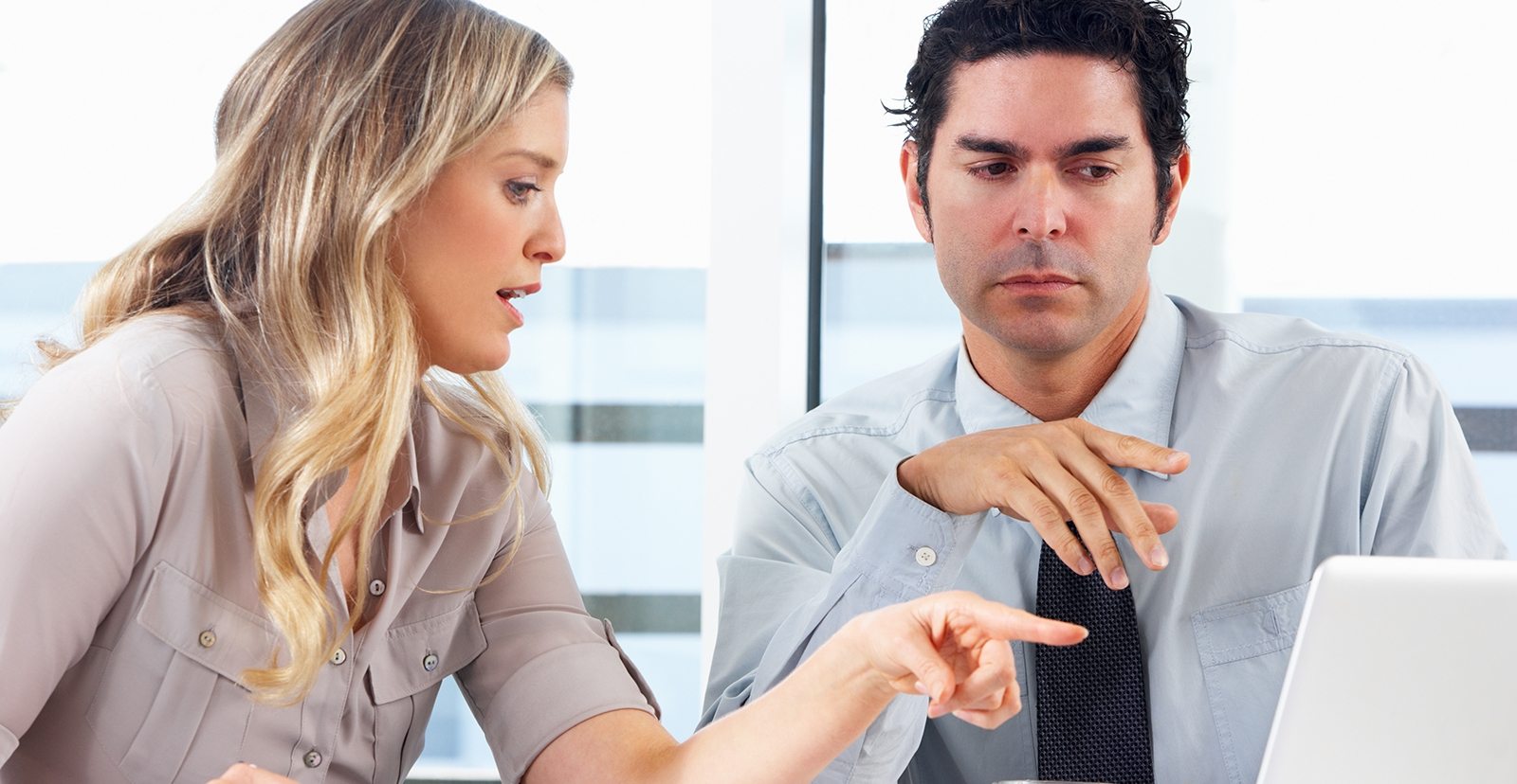 Businessman And Businesswoman Meeting In Office