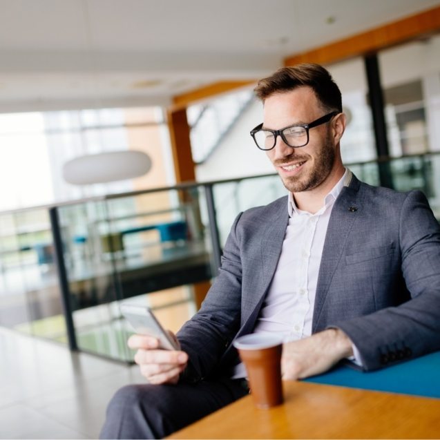 businessman-taking-a-break-with-a-cup-of-coffee-JW4B3DH