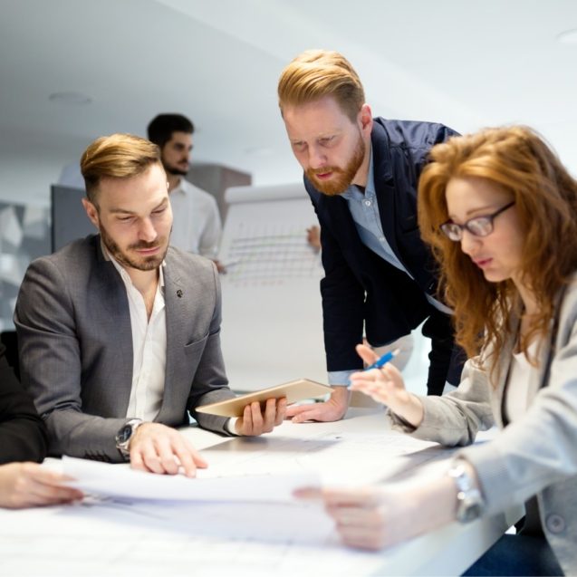 business-people-working-together-on-project-and-B3MZ4TX