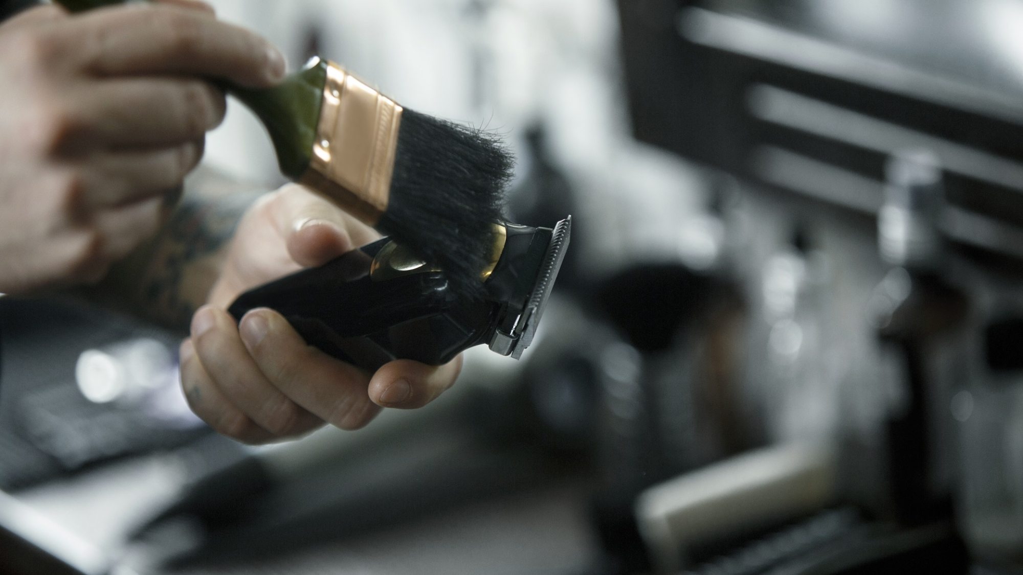 The male hands and tools for cutting beard at barbershop. Vintage tools of barber shop