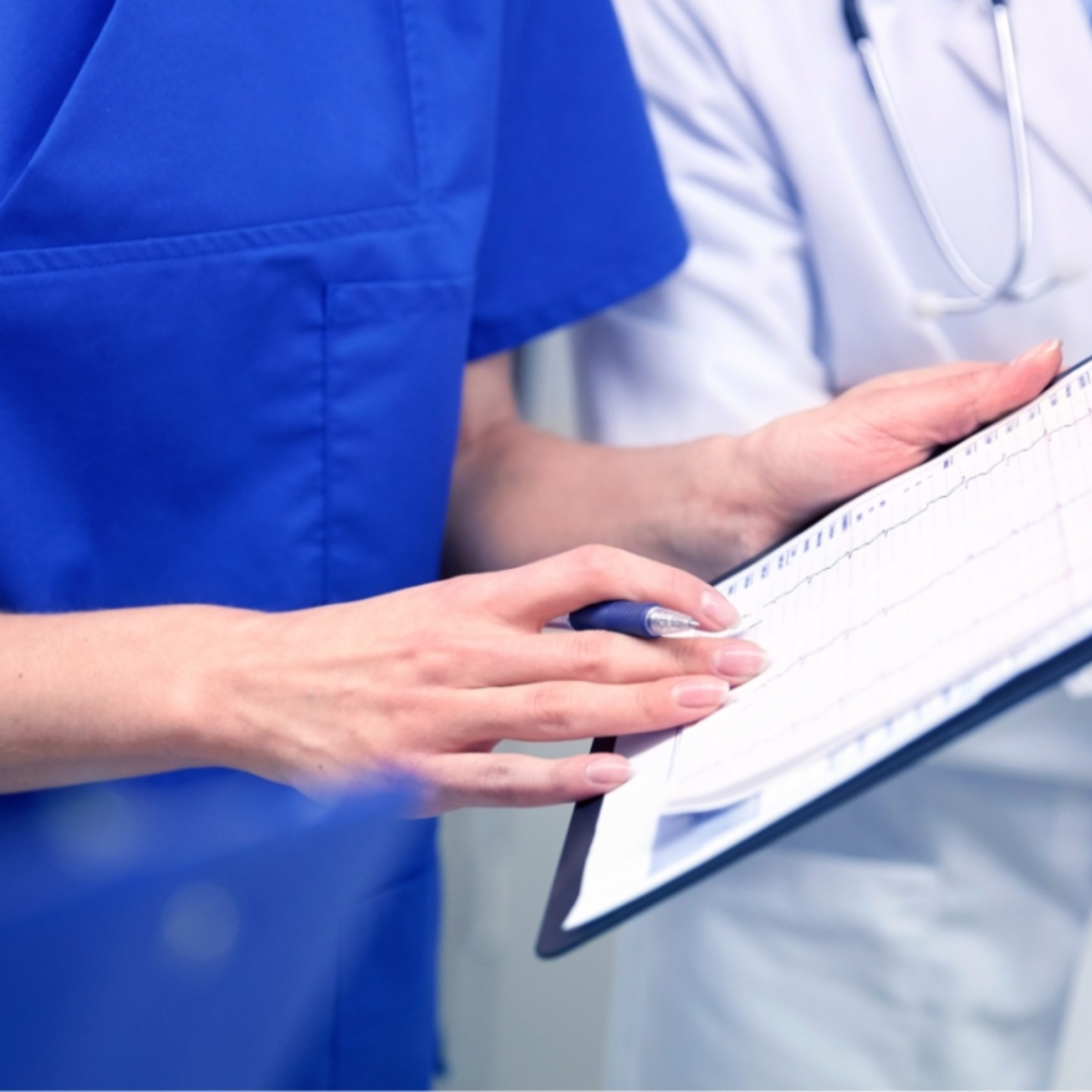 close-up-of-doctors-with-clipboard-at-hospital-PNAWFWS