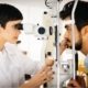 optometrist-examining-patient-in-modern-RXUVD5T