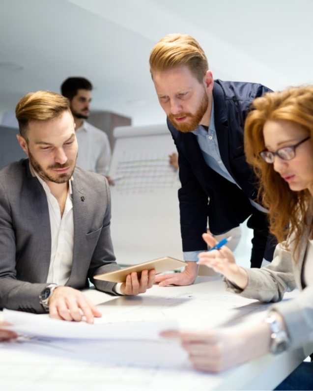 business-people-working-together-on-project-and-B3MZ4TX