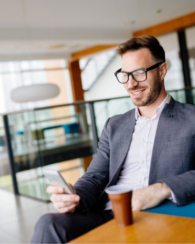 businessman-taking-a-break-with-a-cup-of-coffee-JW4B3DH