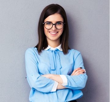 cheerful-young-businesswoman-standing-near-P5A34JE