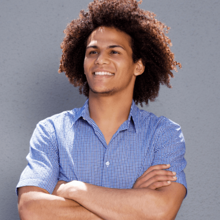 smiling-confident-man-standing-with-arms-crossed-DMBEGAW