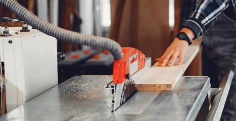 the-carpenter-works-with-a-tree-YUPRN34