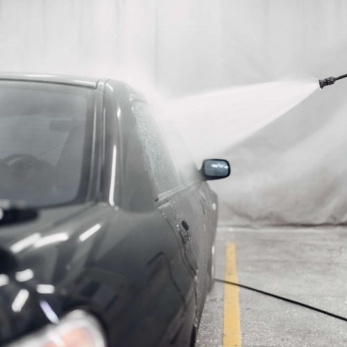 Carwash service, cleaning the car. Auto detailing, high pressure washing on special station