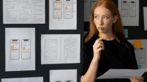 female-web-designer-taking-notes-office