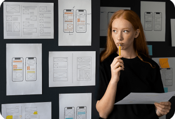 female-web-designer-taking-notes-office