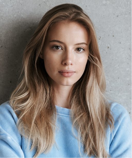 pretty-woman-standing-over-grey-wall-background-4A829TX