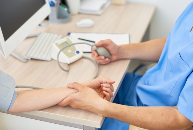 doctor-measuring-blood-pressure-ZF5EDVP