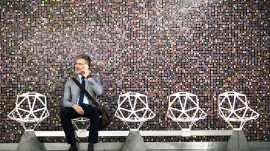 Mature-businessman-with-smartphone-in-a-metro-station.