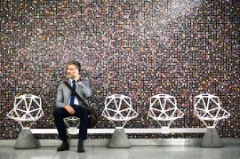 Mature-businessman-with-smartphone-in-a-metro-station.