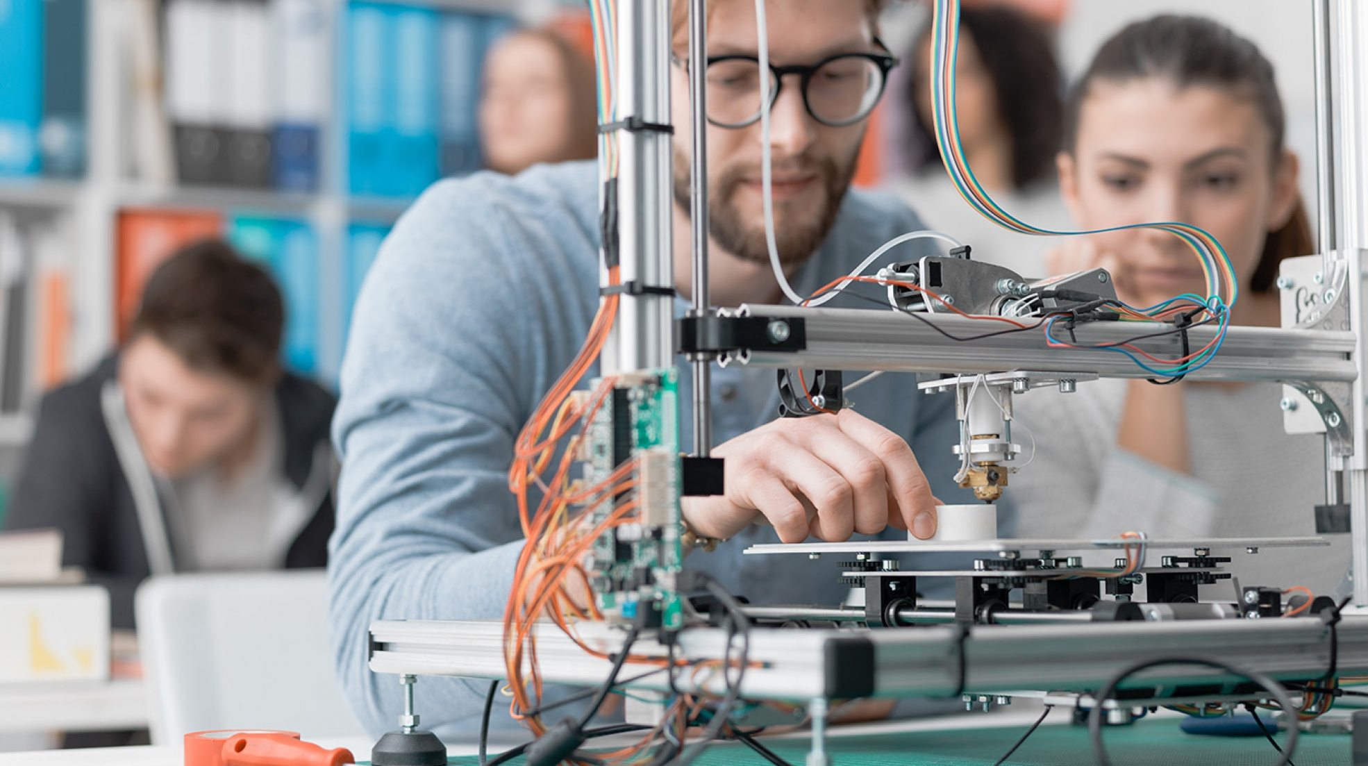 students-using-a-3d-printer-PJKMSXD