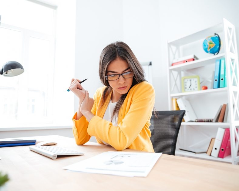 Businesswoman analysing document in office