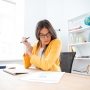 Businesswoman analysing document in office