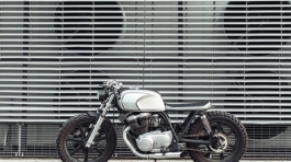 motorcycle-standing-in-dark-building-in-rays-of-P6PVJNM