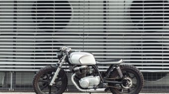 motorcycle-standing-in-dark-building-in-rays-of-P6PVJNM