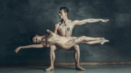 the-young-modern-ballet-dancers-posing-on-gray-JYBC7XQ