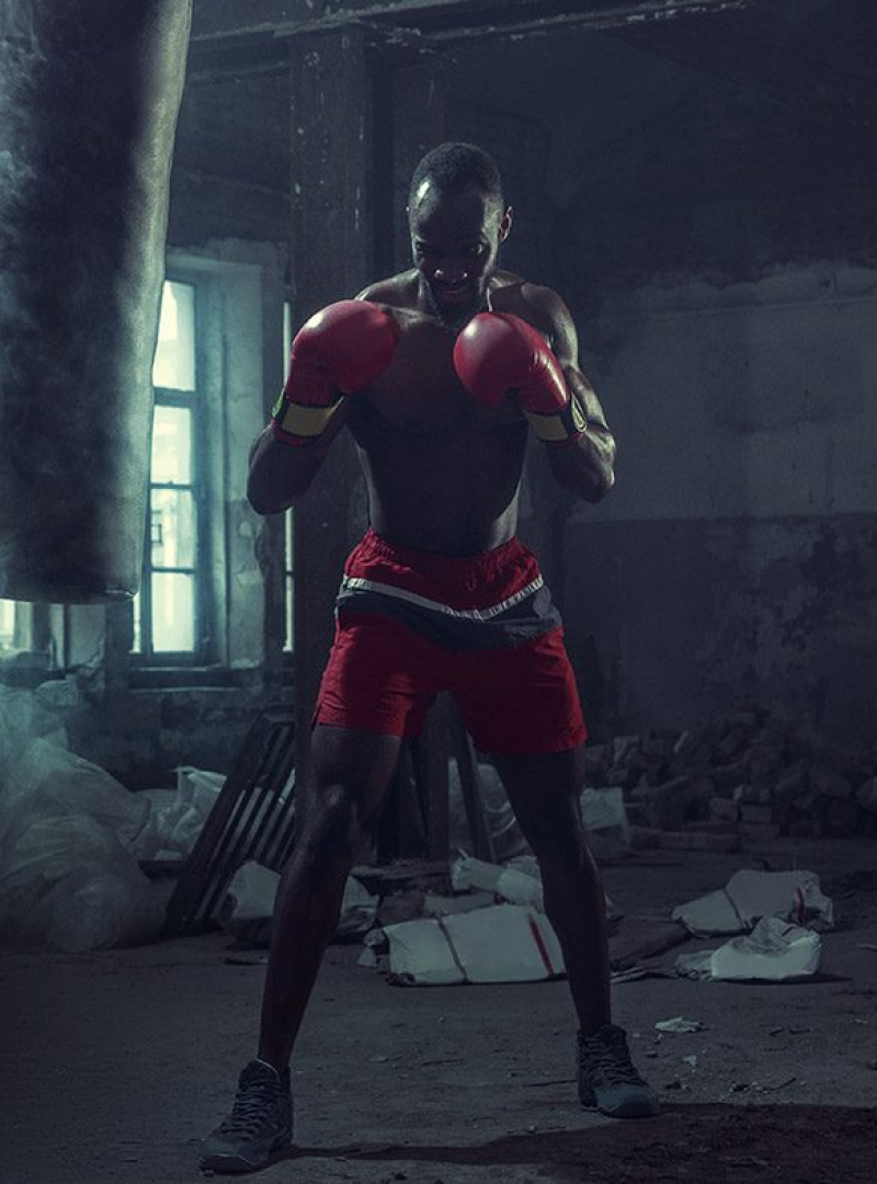 hand-of-boxer-over-black-background-strength-L7JXP4Q