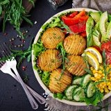 vegetarian-buddha-bowl-raw-vegetables-and-baked-KAYZM53