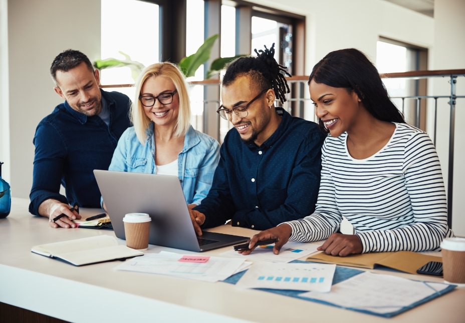 diverse-group-of-colleagues-working-together-at-NVRVQEJ