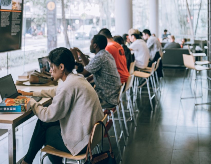 adult-woman-using-netbook-in-contemporary-cafe-3768236