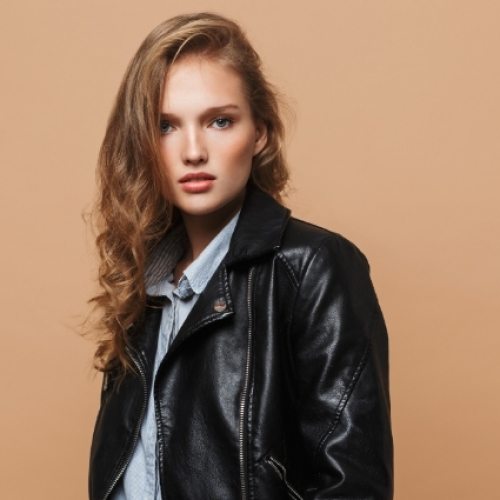 attractive-model-in-black-leather-jacket-intently-FUKRDTN