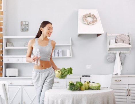 Healthy eating. Dieting and people concept. Brunette with a vegetable.