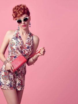 fashion-redhead-model-in-summer-jumpsuit-on-pink-PXX3EL8