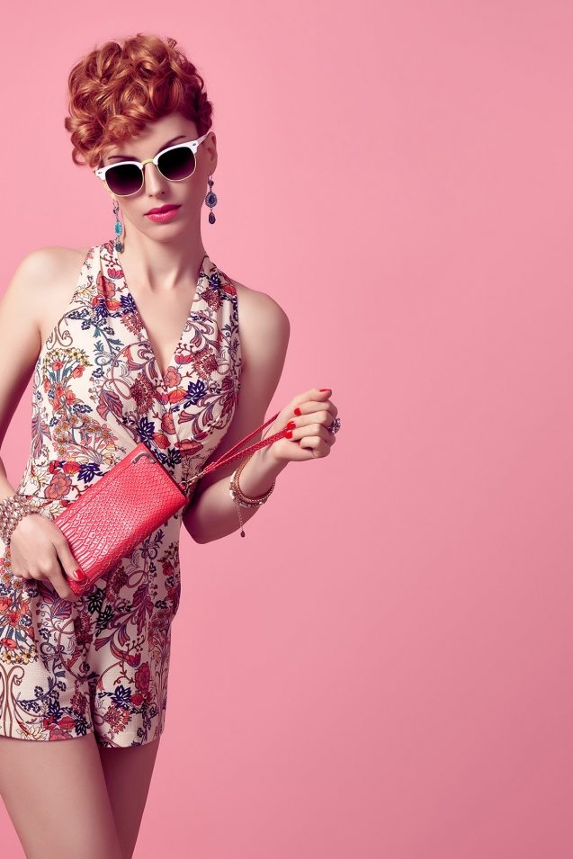 fashion-redhead-model-in-summer-jumpsuit-on-pink-PXX3EL8