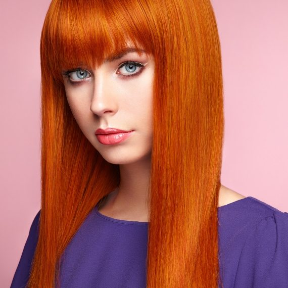 portrait-of-beautiful-woman-with-red-hair-PB3QX44