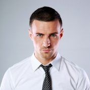 portrait-of-a-confident-man-over-gray-background-PDL3Q9F