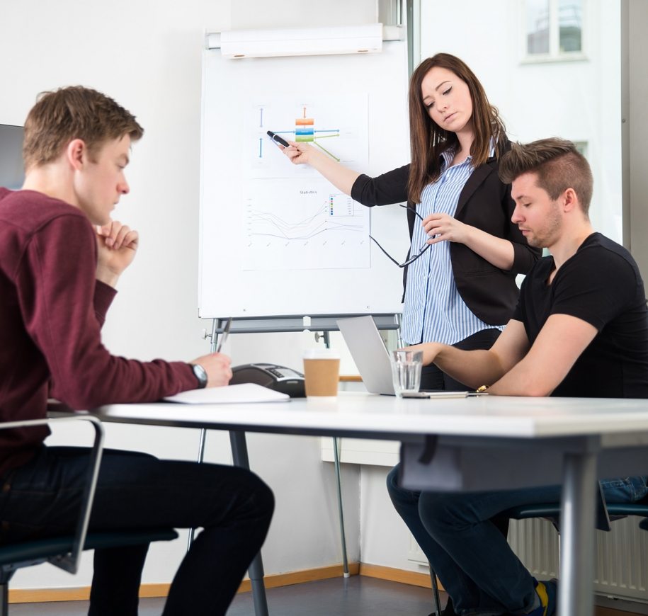 businesswoman-giving-presentation-while-using-PDV6BXH