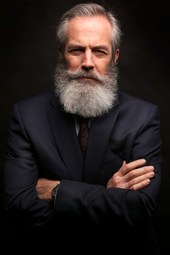 mature-male-model-wearing-suit-with-grey-8LRXCHS