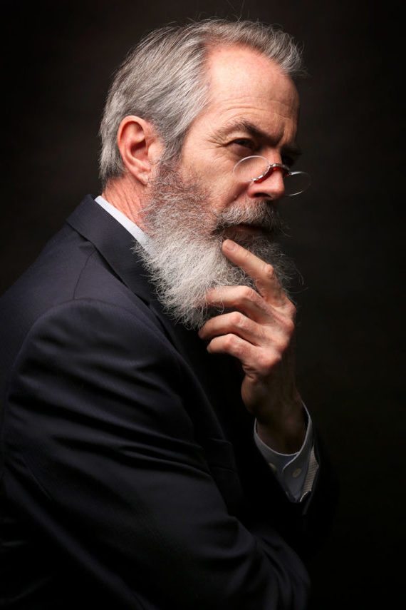 mature-male-model-wearing-suit-with-grey-X2JLGZ9