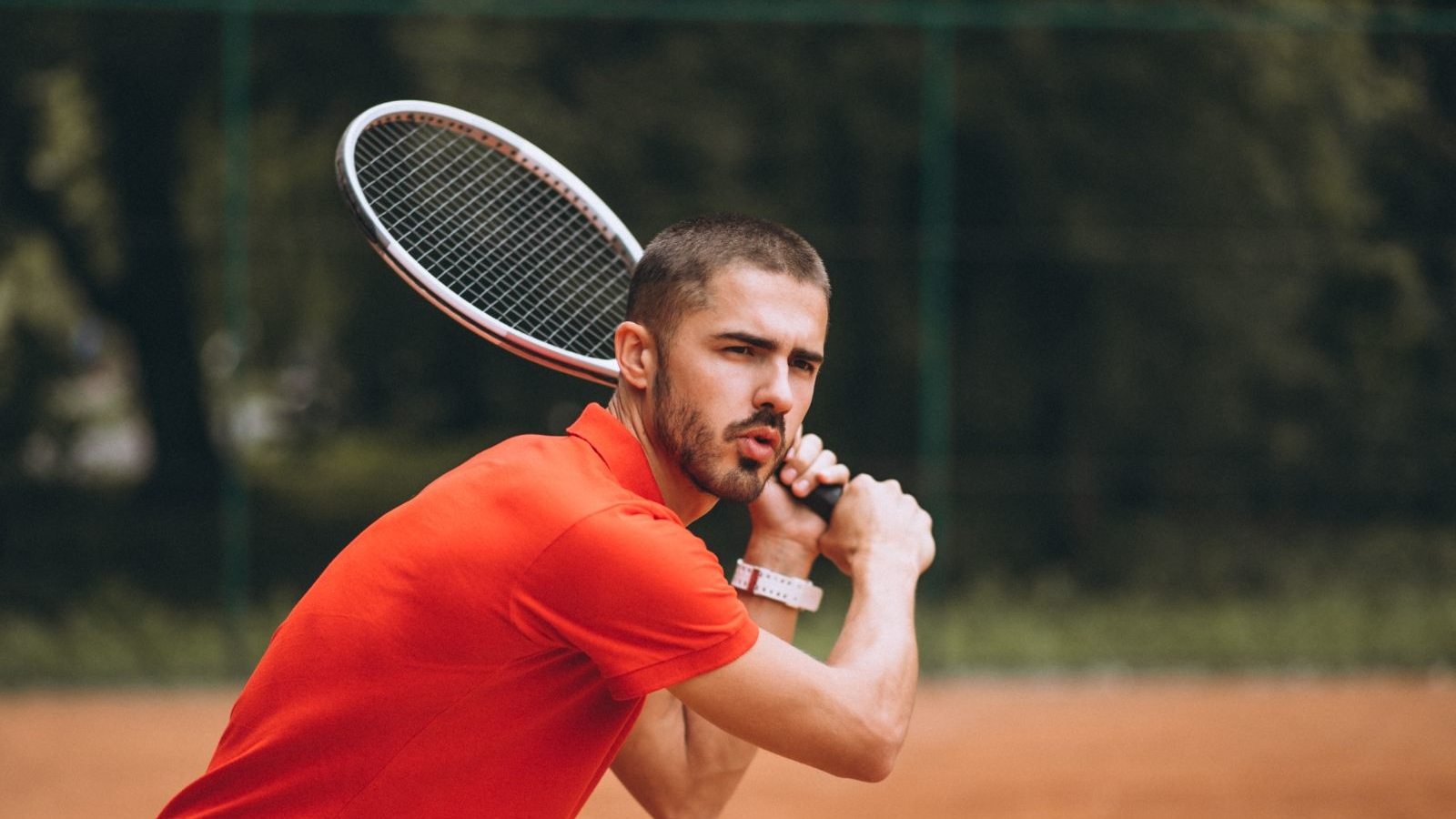 young-male-tennis-player-court