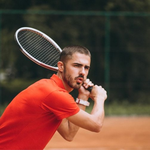 young-male-tennis-player-court
