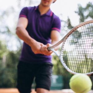 young-man-tennis-player-court-tennis-racket-close-up(3)